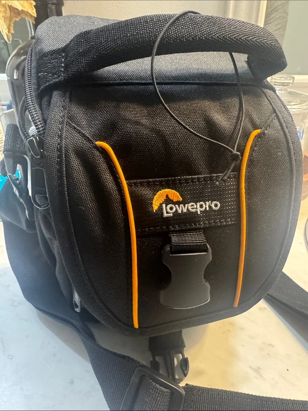 Nikon Black DSLR with Black Lenses and Yellow-Trim Strap